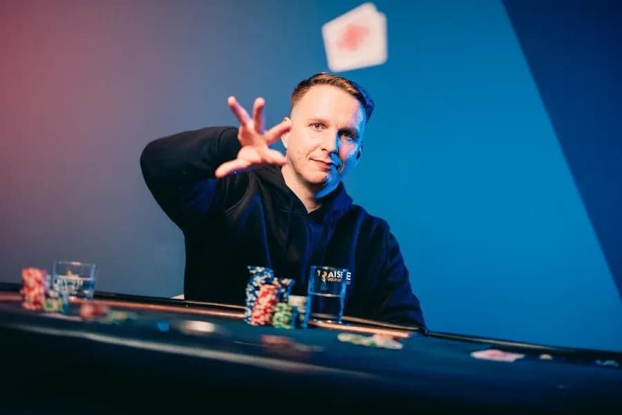 Ben Rolle "Bencb" playing poker and throwing them towards the camera.