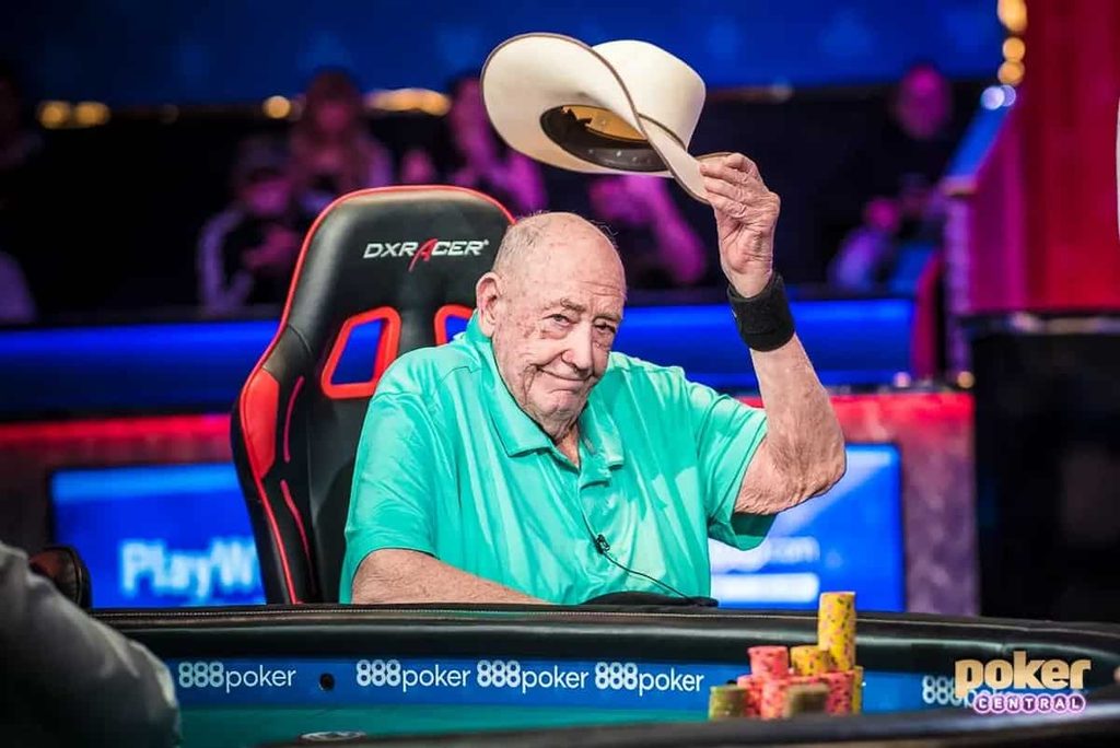 Doyle Brunson lifts his hat to acknowledge a photographer.