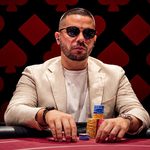 Colombian poker pro Farid Jattin at the poker table with stacks of chips after signing as Stake Poker's first ambassador.